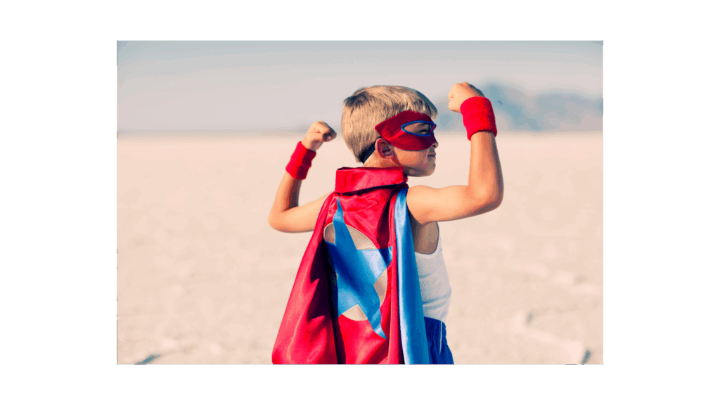Picture of a young boy looking powerful in a super hero cape. Wabi-Sabi Pilates - North Boulder, Colorado