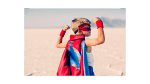 Picture of a young boy looking powerful in a super hero cape. Wabi-Sabi Pilates - North Boulder, Colorado