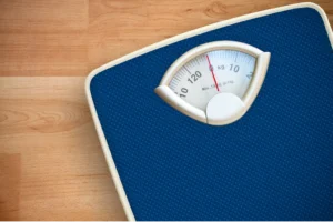 Picure of a Scale implying Pilates will help one lose weight at PIlates in Boulder, Colorado